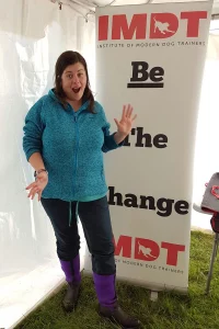 Susan standing in front of an IMDT sign
