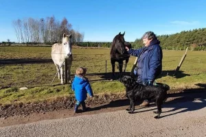 Lorna with Sam, Susan's son and Lorna's two horses