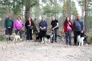 Walk and Train group posing for the camera with Lorna at Culbin Forest